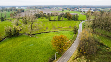 Fototapeta na wymiar Land or landscape of green field in aerial view. Include agriculture farm, house building, village. That real estate or property. Plot of land for housing subdivision, development, sale or investment