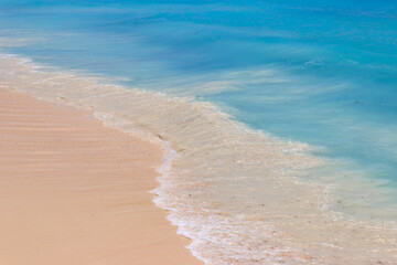 Soft wave of ocean on sandy beach