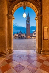 Fotobehang Vertical shot of the magical and beautiful cityscape of Venice, Italy during an evening © Denis Scarpante/Wirestock