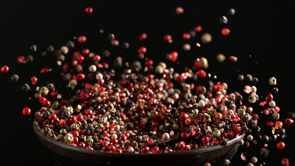 Freeze motion of crushing pepper balls in grinder.