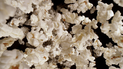 Macro shot of falling popcorn on black background