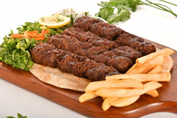 kebab and grilled vegetables isolated on a white background.