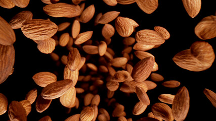 Freeze motion of flying whole almonds.