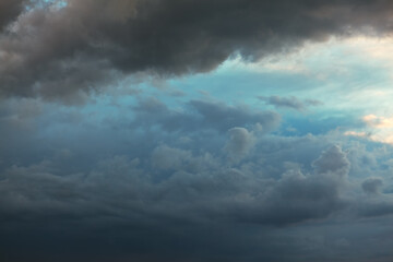 Naklejka na ściany i meble Blue clouds in low light . Sky before storm 
