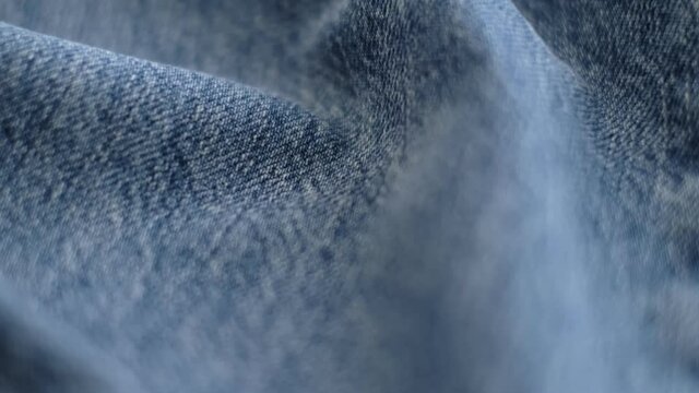 Denim Jeans Fabric Texture Close-Up. blue denim jeans material. close-up of clothing material fabric texture. footage video