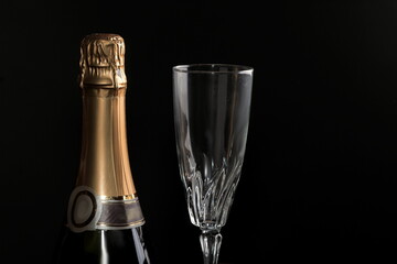 champagne bottle with black background on table no people  stock photo