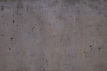 perforated concrete wall, different shades of grey