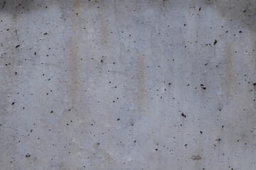 texture of pierced cement with different grey tones