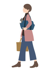 犬をキャリーバッグに入れて運ぶ女性（動物病院・災害避難・ペット旅行のイメージに）