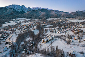 Fototapeta na wymiar Zakopane Cityscape in Winter with Giewont Mountain. Drone View