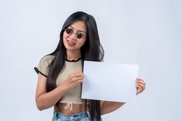 woman holding white paper on a white background