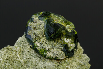 macro mineral stone Andradite on a black background