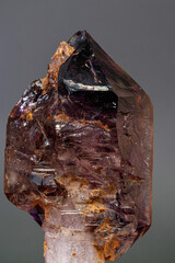 macro mineral stone  amethyst with smoky quartz on a black background