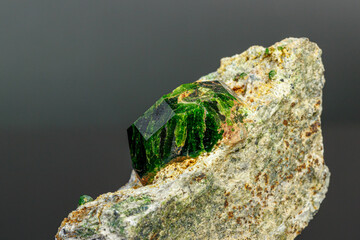 macro mineral stone Andradite on a black background