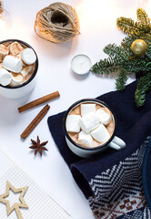 Fototapeta na wymiar Christmas, New Year white composition with cups of hot chocolate with marshmallow. Winter holiday flat lay. Top view 