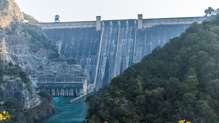 Bhakra Dam is a concrete gravity dam on the Sutlej River in Bilaspur, Himachal Pradesh in northern India. The dam forms the Gobind Sagar reservoir.