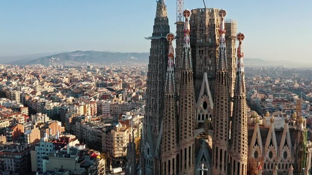 Aerial view of Expiatory Temple, Church, Basilica of the Sagrada Familia in Barcelona, Catalonia, Spain. Picturesque cityscape, sunny day