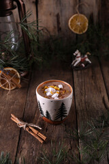 Obraz na płótnie Canvas Cocoa with marshmallows and citrus zest on christmas background