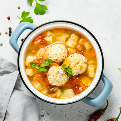 Cosy winter meatball soup in pot. Top view, copy space.