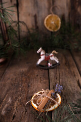 Christmas decorations and coniferous branches on wooden background