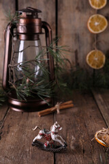 Christmas decorations and coniferous branches on wooden background