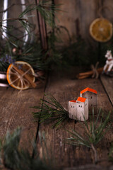 Christmas decorations and coniferous branches on wooden background