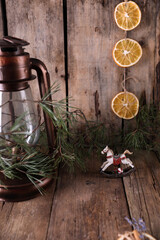 Christmas decorations and coniferous branches on wooden background