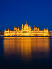 Parliament building in Budapest, Hungary. Parliament and reflections in the Danube River.