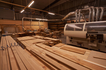 Focused photo on wooden planks being in workshop