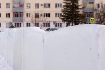 Ice slab fence in the city. Ice fence.