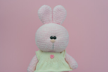 Crocheted plush pink bunny. Soft toy knitted bunny.
