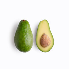 Ripe avocado on a white background, halves of avocado.