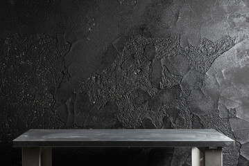 Empty workbench on the black wall background with copy space. - obrazy, fototapety, plakaty