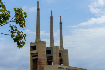 Abandoned Thermal Station. Fecsa power station in Badalona, Barcelona, Spain. Three chimneys