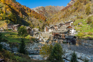 Fototapeta premium The beautiful village of Rassa, during fall season, in Valsesia (Sesia Valley). Province of Vercelli, Piedmont, Italy.