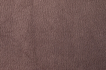 The texture of the fabric. Brown jacquard close-up. Soft expensive fabric for furniture, curtains, pillows and car upholstery. Background. A place to copy.