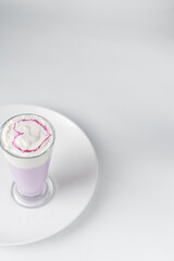 Purple latte with a love sign, heart latte art, valentine latte