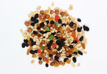 handful of snacks on a white background. nuts, candied fruits and dried fruits.