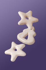 white cookies in glaze on purple background, flying food