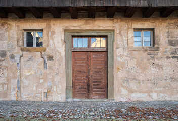 Old door and windows of an ancient house 