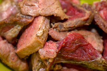 Close-up of chopped raw pork pieces with seasoning