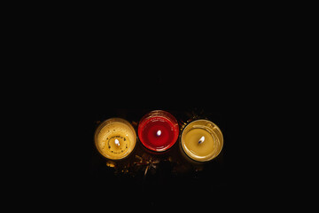 Three Christmas candles decoration glowing in the dark horizontal