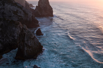 Cliffs and rocks rasing in at Atlantic coast of Portugal near Cabo Da Roca.