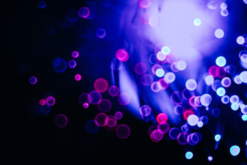 sparkling abstract bokeh background neon color with glitter circles defocused particles on dark background for overlay screen. Abstract Festive lights defocused.