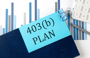 403 b PLAN on sticky note on the notebook on the chart background