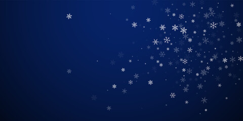 Obraz na płótnie Canvas Sparse snowfall Christmas background. Subtle flyin