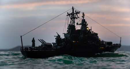 Silhouettes of a crowd standing at blurred military war ship on foggy background. Selective focus.