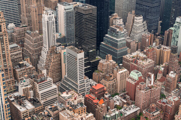 Fototapeta premium Aerial panoramic city view of Upper Manhattan area and East Side neighborhoods, New York city, USA. Iconic cityscape of building exteriors of NYC from roof top