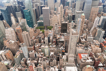 Aerial panoramic roof top city view of New York City Financial Downtown district at day time. Manhattan, NYC, USA. A vibrant business neighborhoods