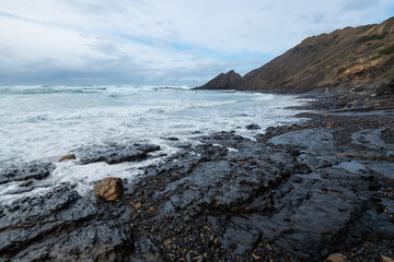 Aljezur coast of the Algarve, Portugal. Winter time, high tide.